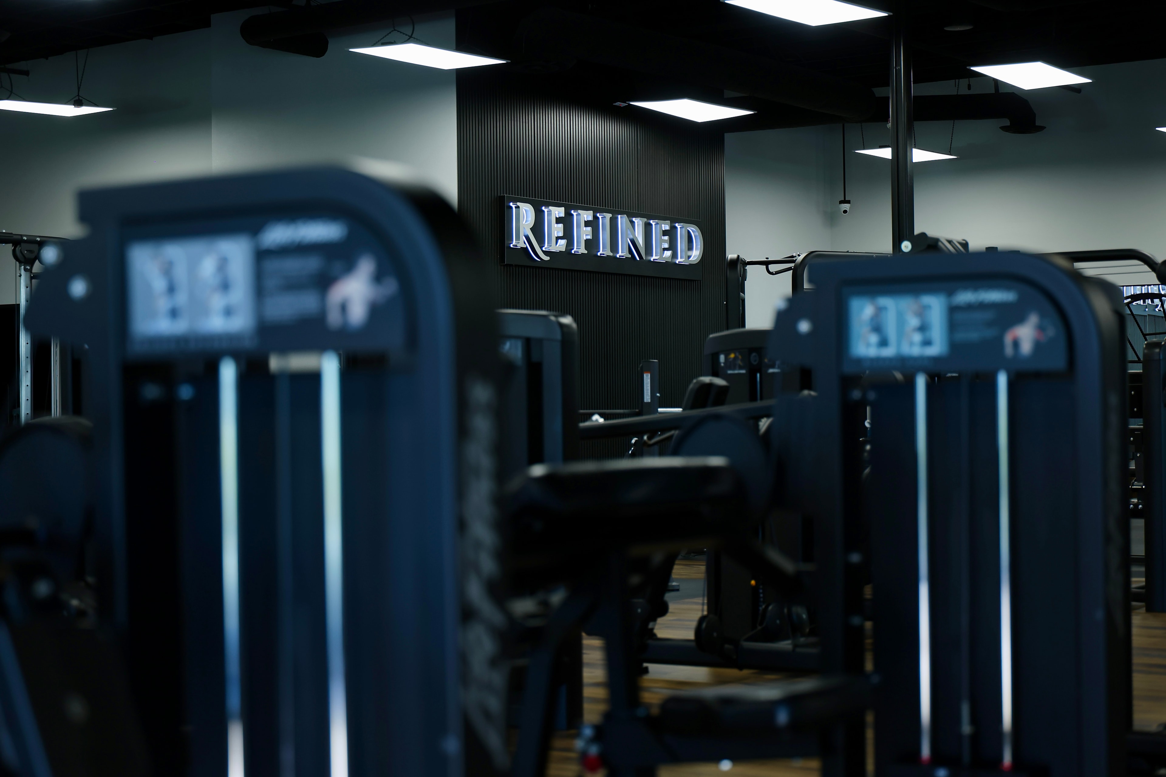 Machines and free weights at Refined GYM — fully equipped fitness facility serving Henderson and Las Vegas NV