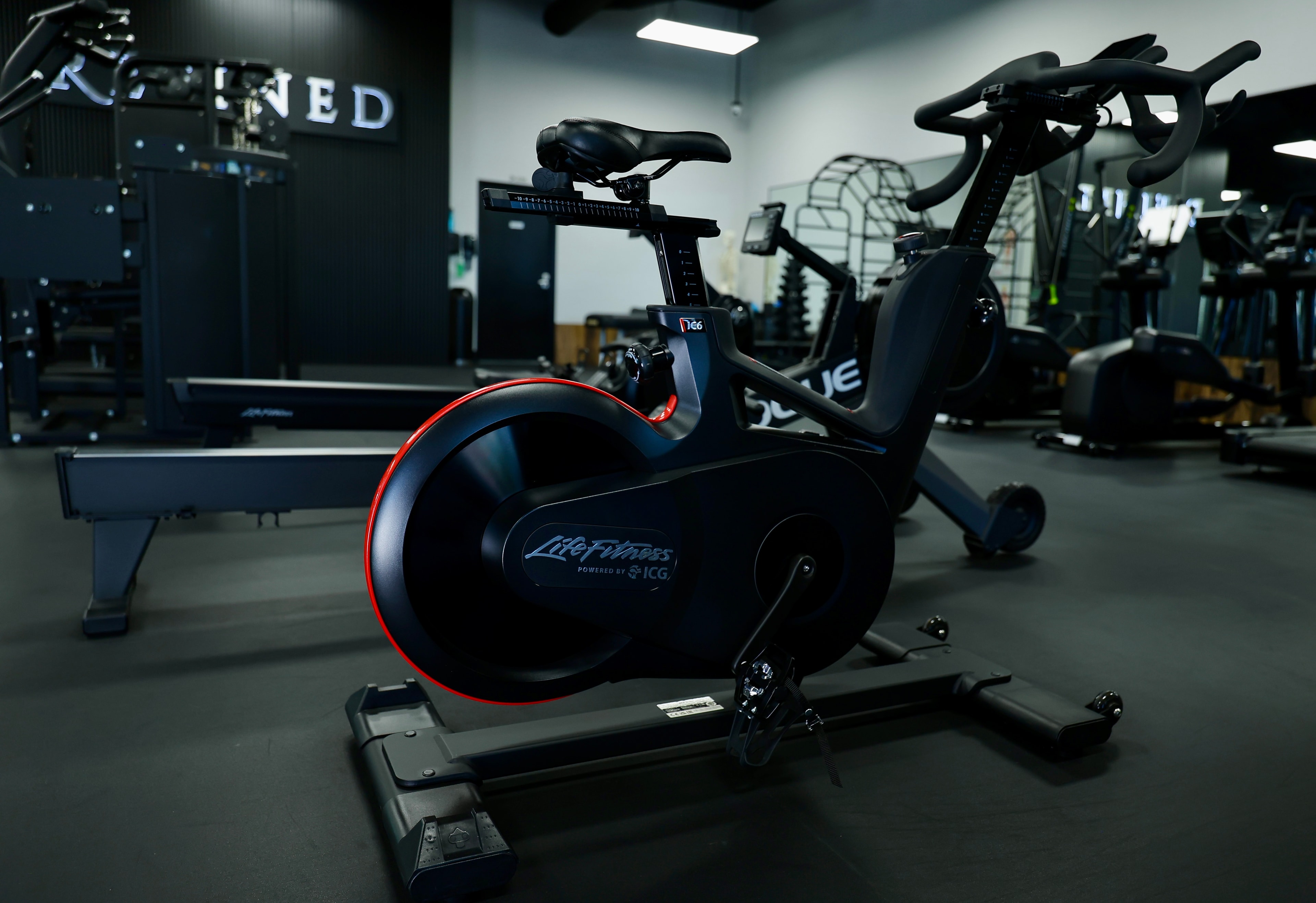 Row of stationary bikes at Refined GYM — never wait for equipment at this 24/7 Henderson NV gym